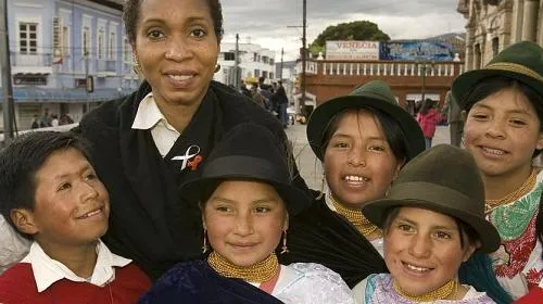 CARE CEO Dr. Helene Gayle with children in Ecuador. She's led CARE since 2006.  Photo courtesy: AJC