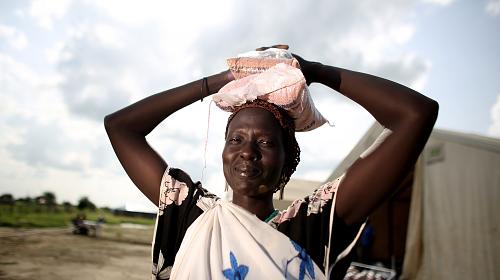 Woman receives seeds to plant after being displaced by South Sudan conflict. PHOTO:  Josh Estey/CARE