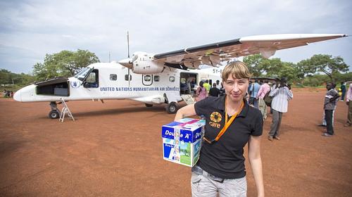 CARE staff helps to unload supplies in South Sudan. © 2014 Josh Estey/CARE