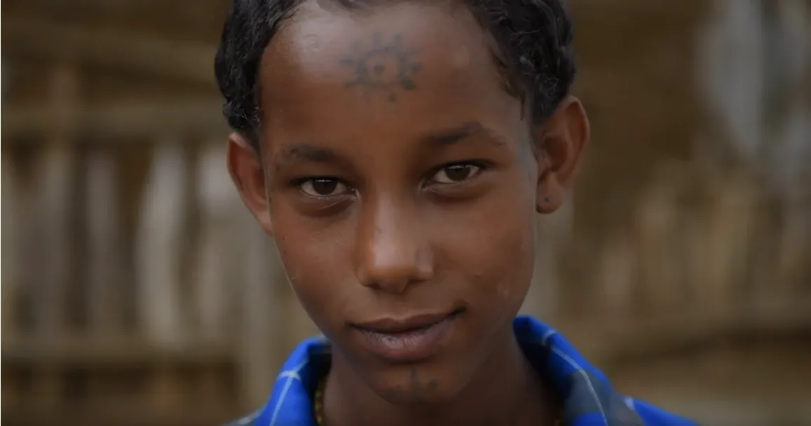 A close-up portrait of a young girl