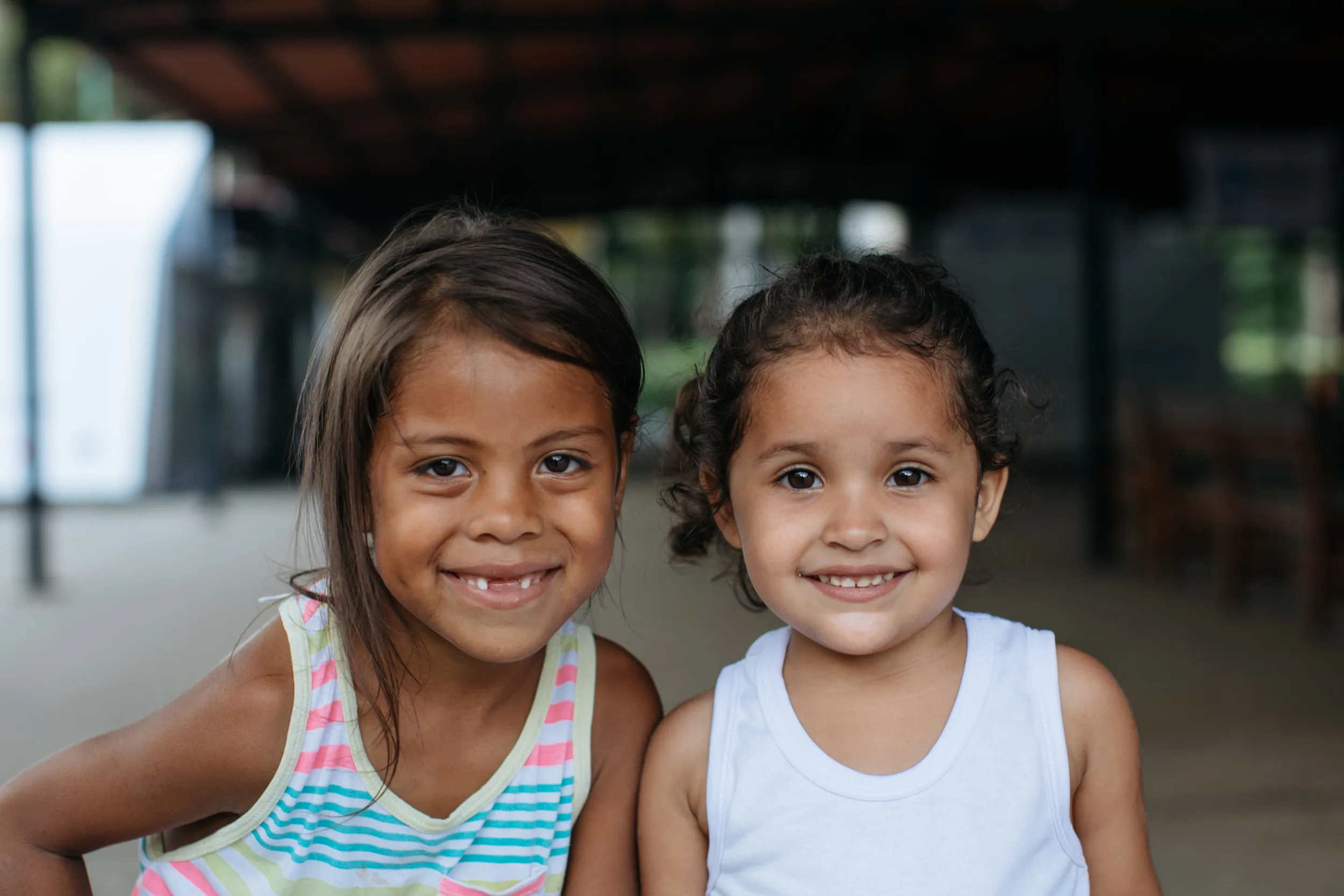 Salma, left, and Ariana, right, fled Venezuela with their family. Photo credit: Paddy Dowling