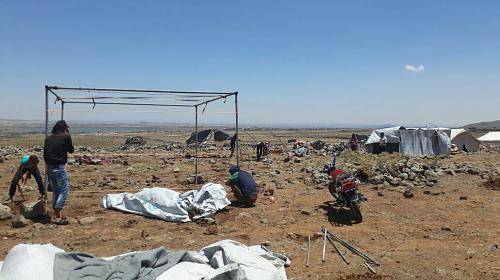 Civilians displaced by the fighting in Daraa governorate look for safe places to set up tents in informal camps in Southern Syria. Up to 50,000 people had to move in eight days, and are in desperate need of shelter, clean water, and food. Credit: CARE. 