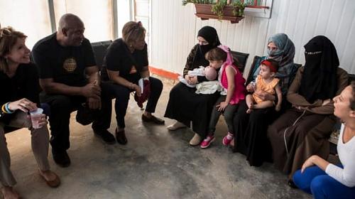 U.S. Representatives Cheri Bustos (left), Dwight Evans (center) and Brenda Lawrence (right) hear the stories of beneficiaries mothers of at the Zaatari camp UNFPA maternity hospital clinic in Zaatari camp in Jordan. Photo by: Sarah Grile / CARE.