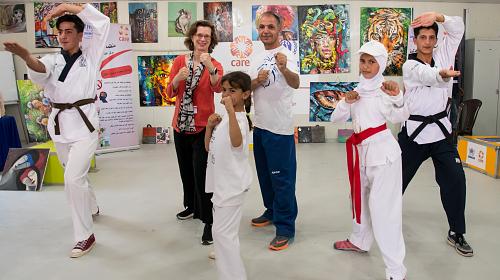 CARE operates community centers in Azraq Refugee Camp where Syrian refugee children learn taekwondo. Michelle Nunn, CARE president and CEO learns a few moves. Credit: CARE/Carey Wagner  