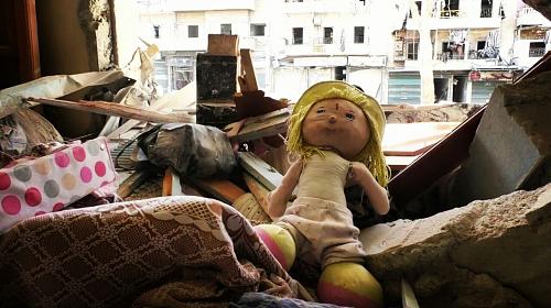 A child's doll found in the remains of a destroyed home in eastern Aleppo. ©️ 2016 Ahmad Makiya/CARE