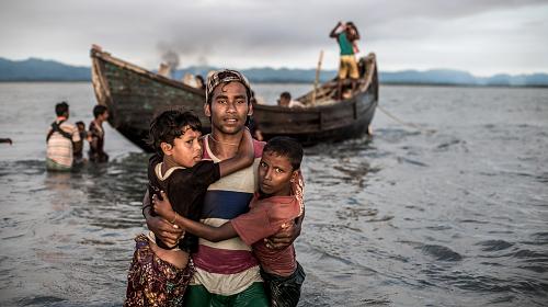 Refugees in Myanmar arrive in Bangladesh. 