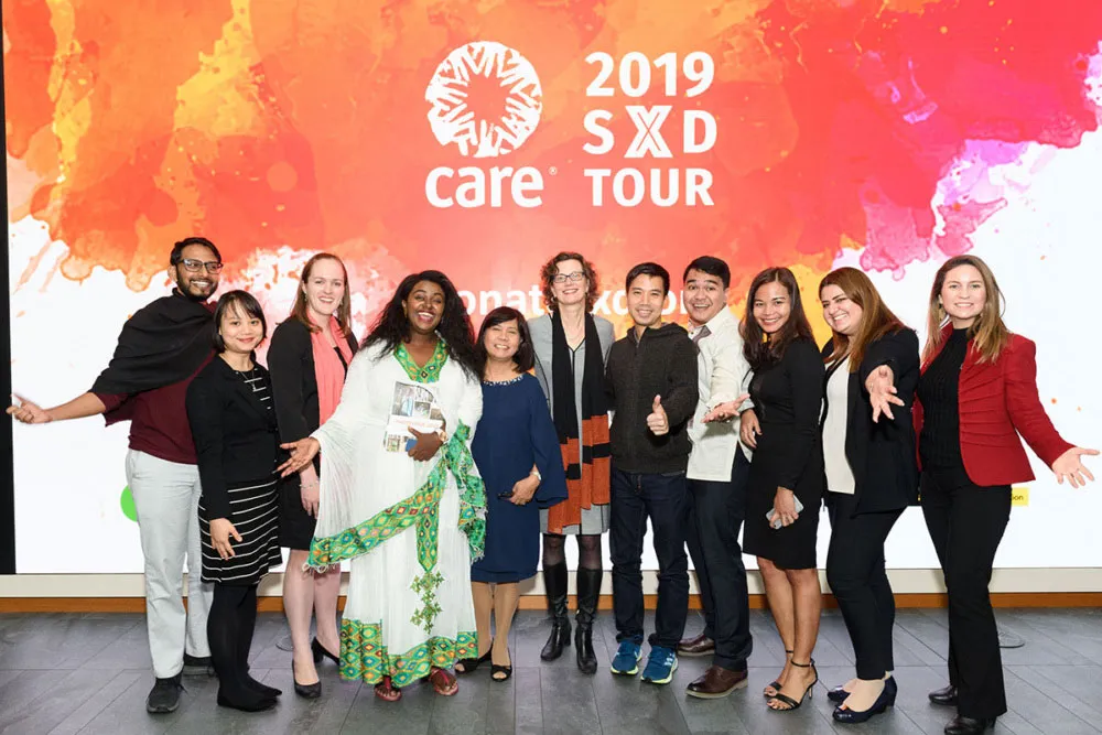 A group of people pose for a photo on the 2019 Scale by Design tour.