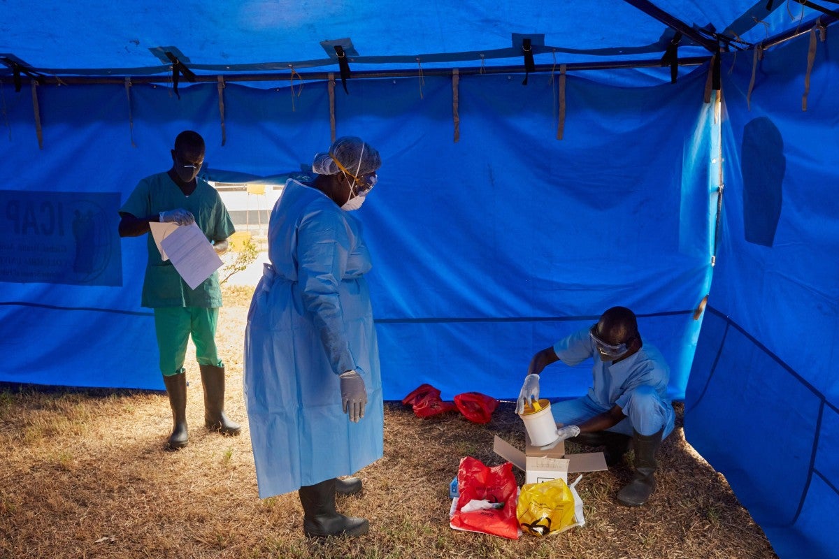A member of South Sudan’s rapid response team collects a sample taken from a man who had been in contact with a confirmed coronavirus case. Photo: AFP