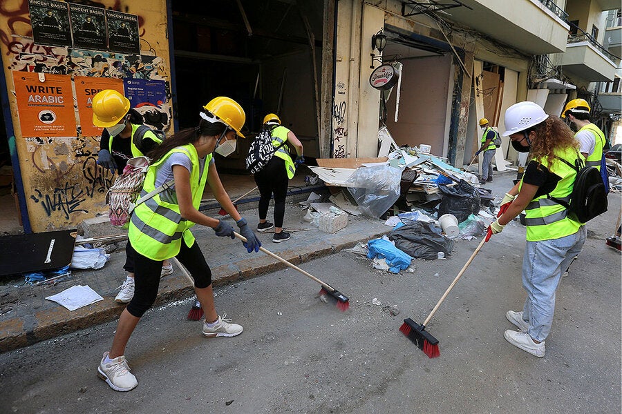 Volunteers clean debris on Aug 7, 2020 following the massive explosion in the port area of Beirut, Lebanon. Aziz Taher/Reuters