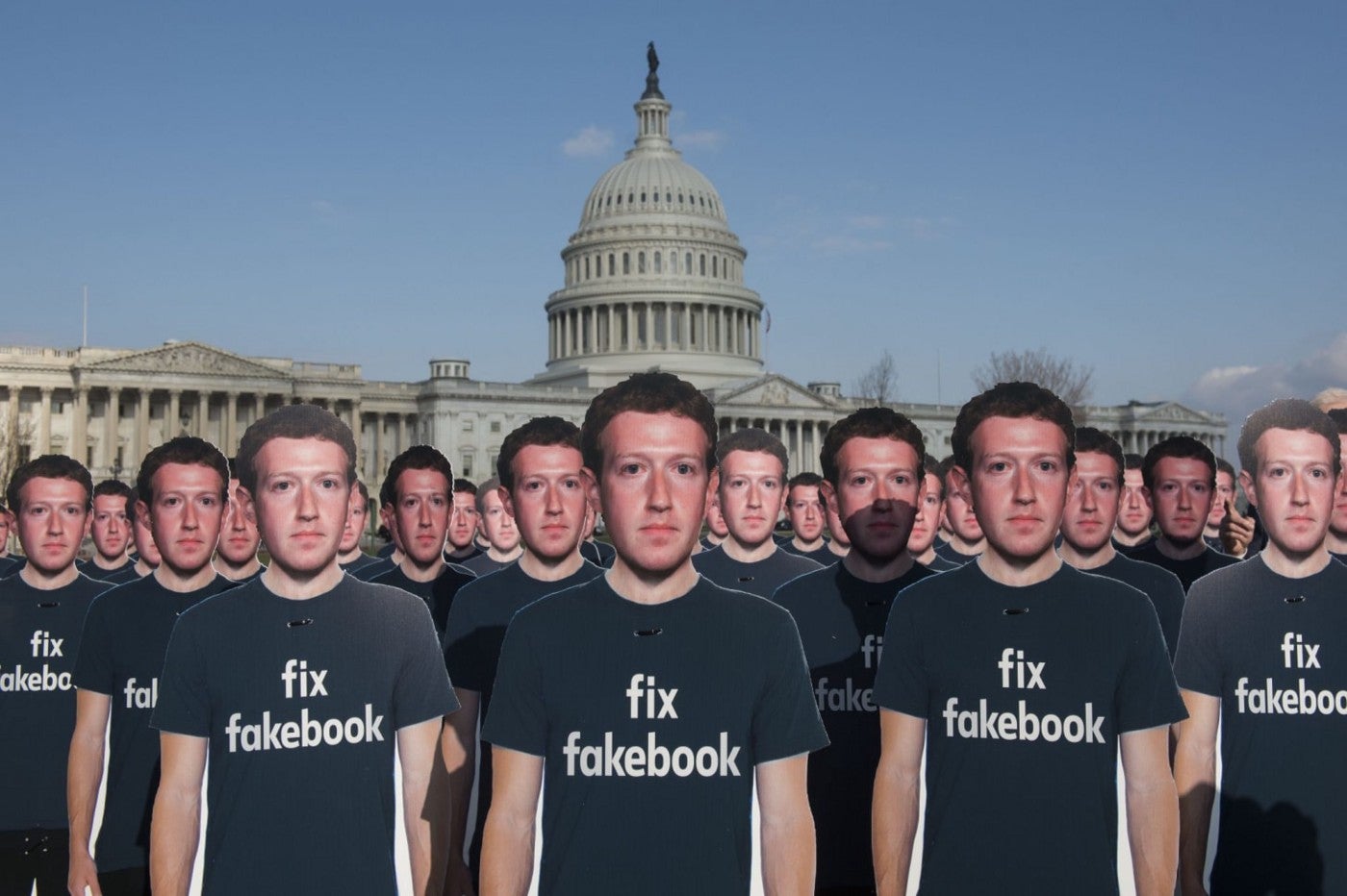 Cardboard cutouts of Facebook founder and CEO Mark Zuckerberg stood outside the U.S. Capitol on April 10, 2018, placed there by the advocacy group Avaaz to call attention to fake accounts spreading disinformation on Facebook. (Kevin Wolf/AP images for AVAAZ)