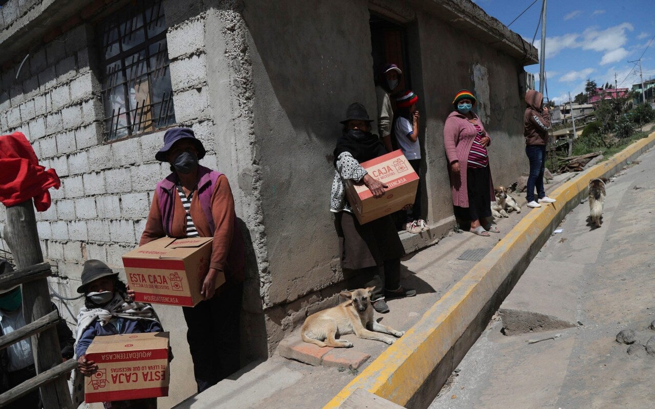 As well as emojis, women have been trying to get the message out by asking for different coloured government food aid boxes, as seen here in Quito, Ecuador CREDIT: Dolores Ochoa/AP