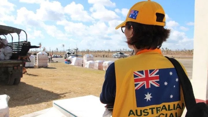 An Australian Embassy official observing humanitarian relief efforts in Guiuan, Philippines. Photo by: Gemma Haines / Department of Foreign Affairs and Trade / CC BY