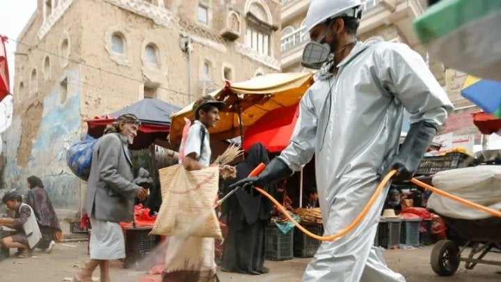 A health worker disinfects a market amid concerns of the spread of COVID-19 in Sanaa, Yemen. Photo by: REUTERS / Khaled Abdullah