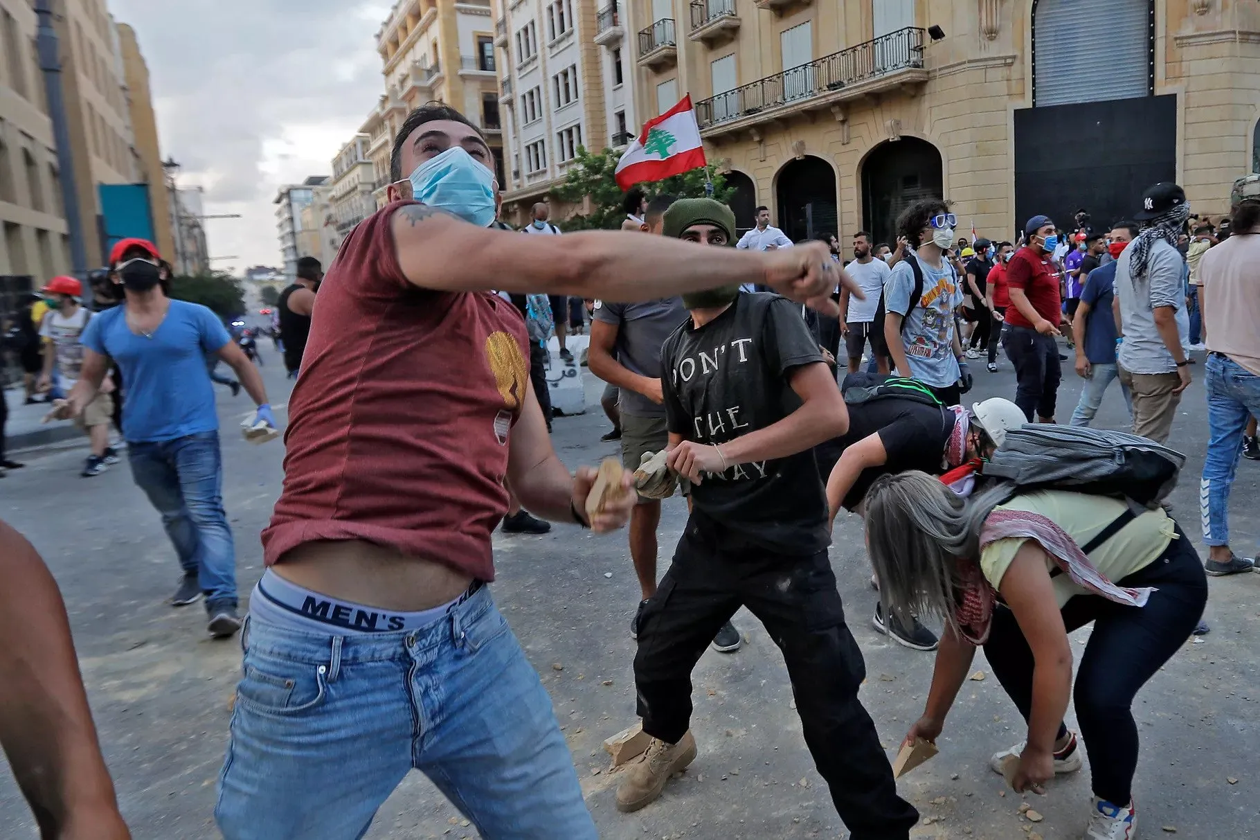 Lebanese protesters, enraged by last week’s deadly Beirut explosion, hurl stones at security forces amid clashes in the vicinity of the parliament building in central Beirut on August 10, 2020. Joseph Eid/AFP via Getty Images