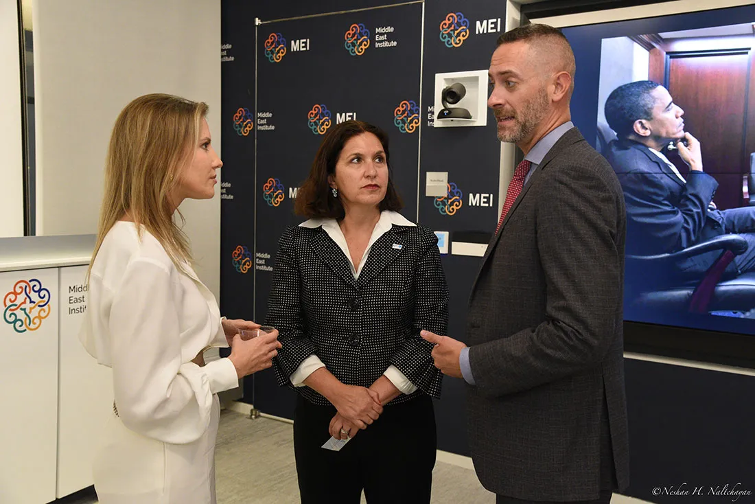 CNN senior diplomatic correspondent Michelle Kosinski speaks with two attendees.