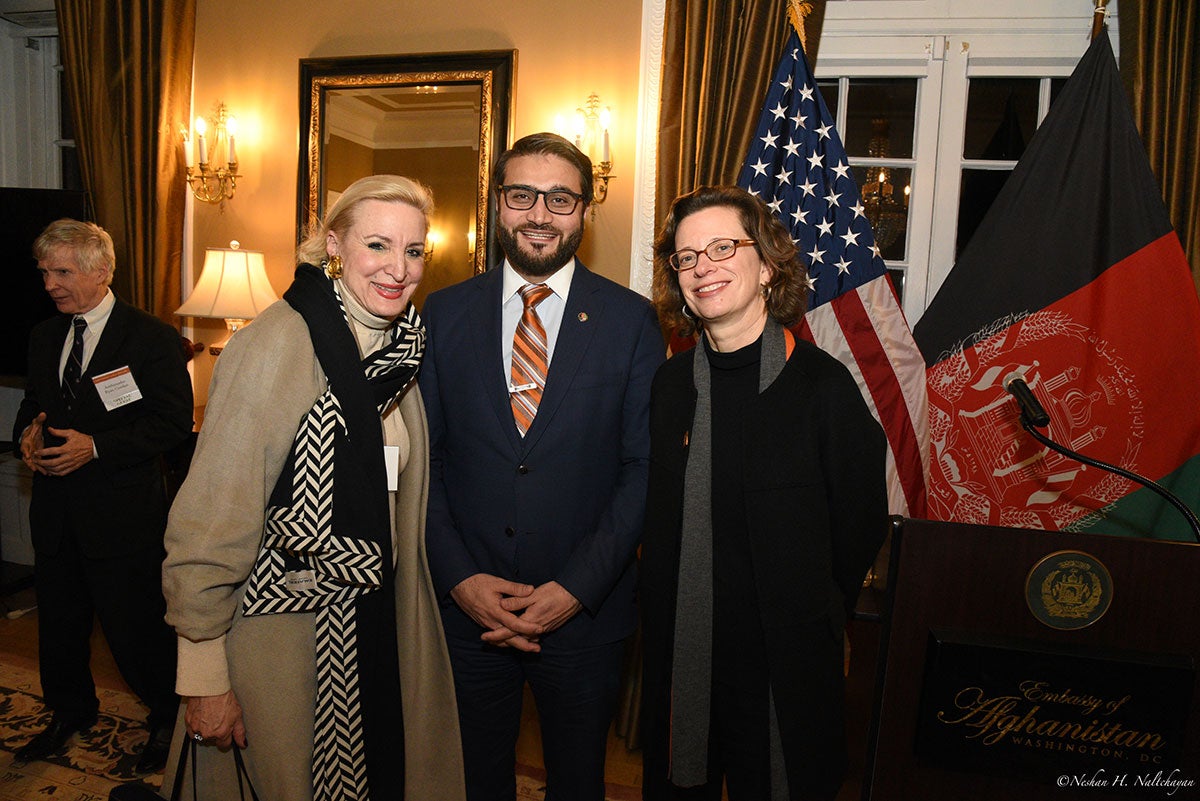 A woman stands next to CARE CEO Michelle Nunn and Ambassador Hamdullah Mohib