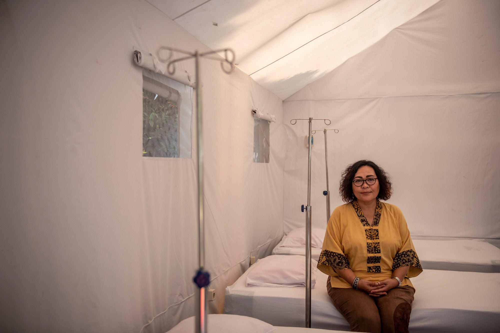A portrait of CEO Care Indonesia Bonaria Siahaan inside the negative pressure tent in Public Health Center Pematang, Serang, Banten Province, Indonesia, Tuesday 3rd, 2021.