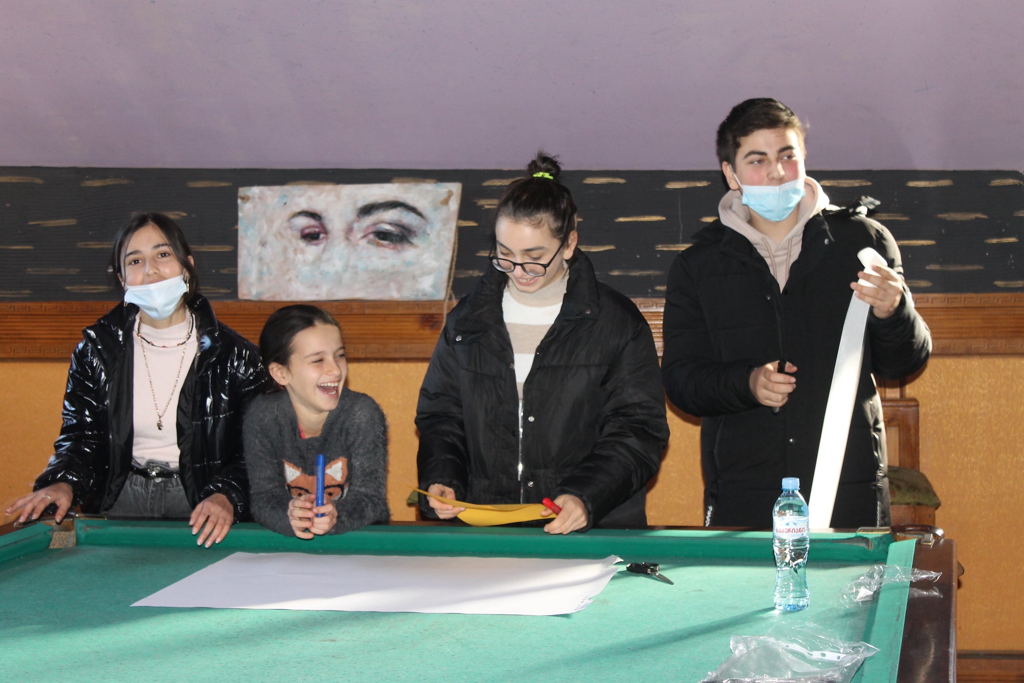 Four students participating in an activity.