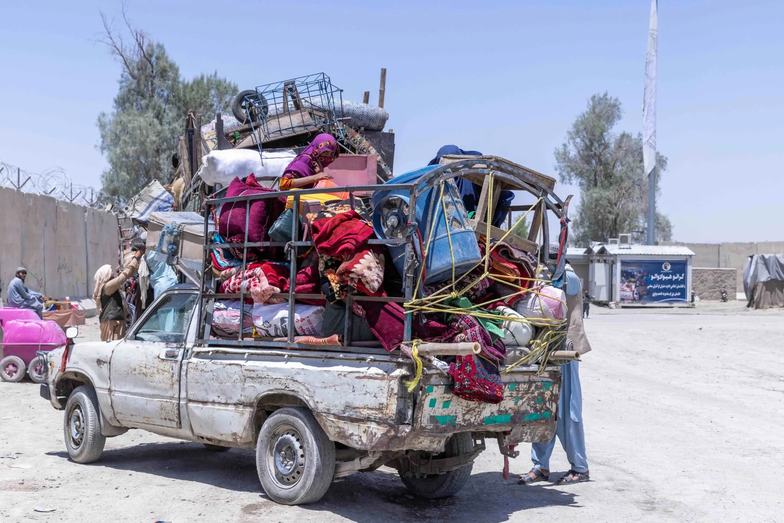 A woman on a family truck at the Afghanistan - Pakistan border