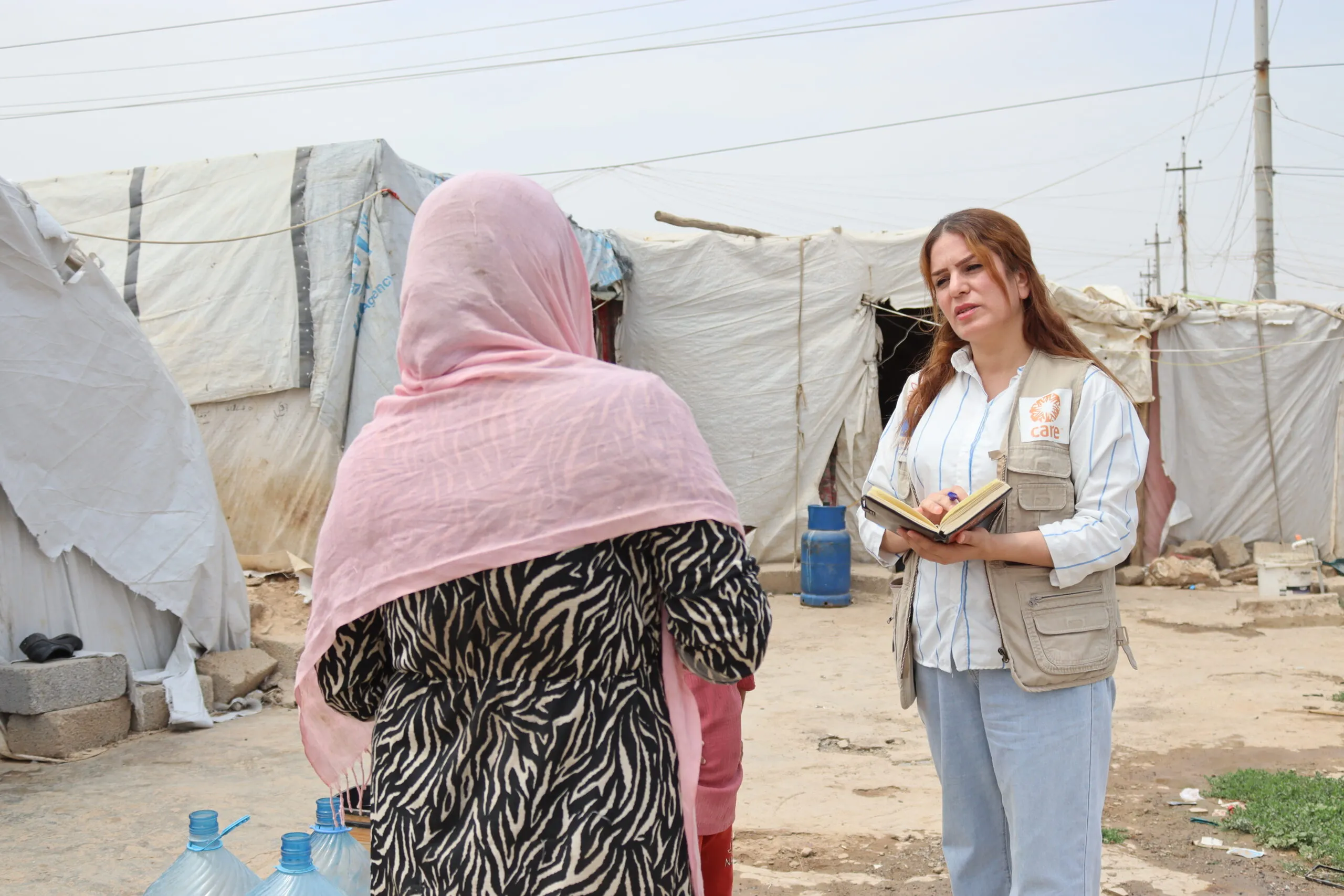 Haifa, an aid worker in Iraq, with a CARE partner.