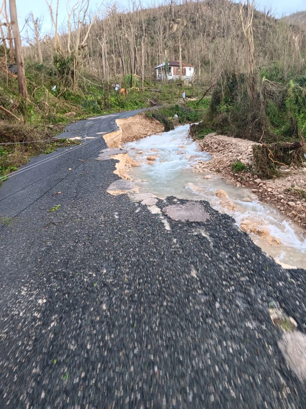 A road washed by flooding in Jamaica