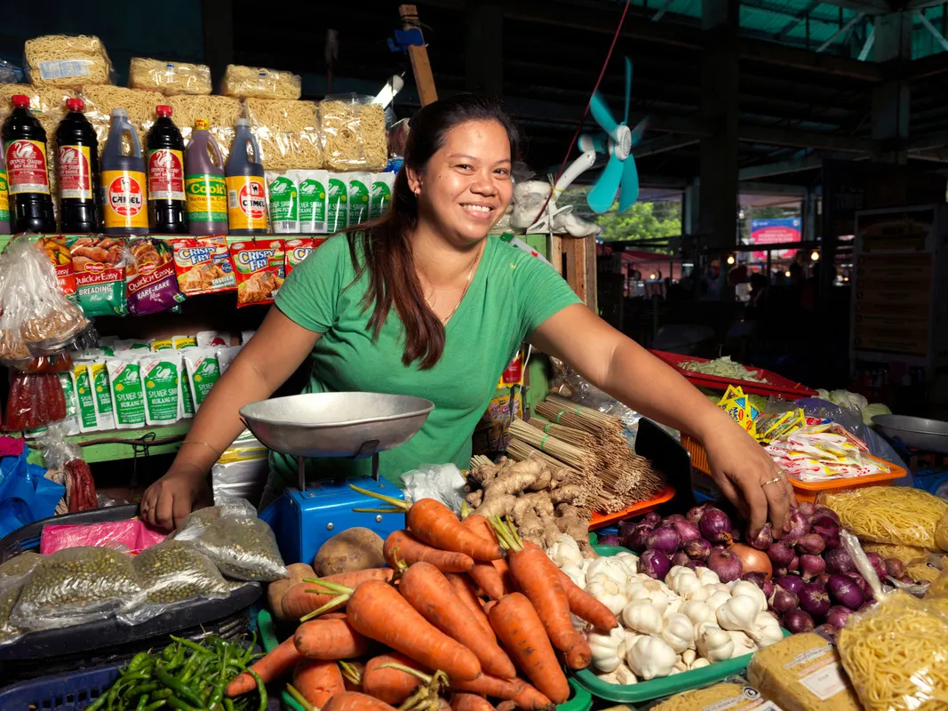 Woman running a small grocery stall