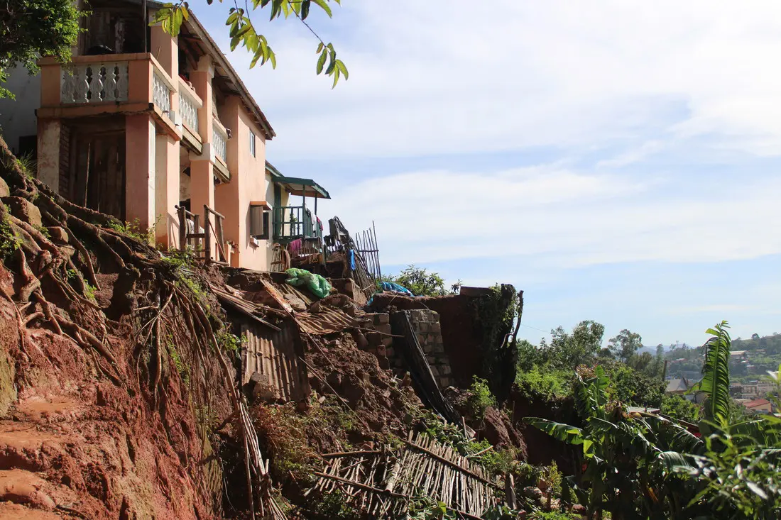 View of hillside in tropical area after a landslide, demonstrating the impact of cyclone Batsirai in Fianarantsoa.