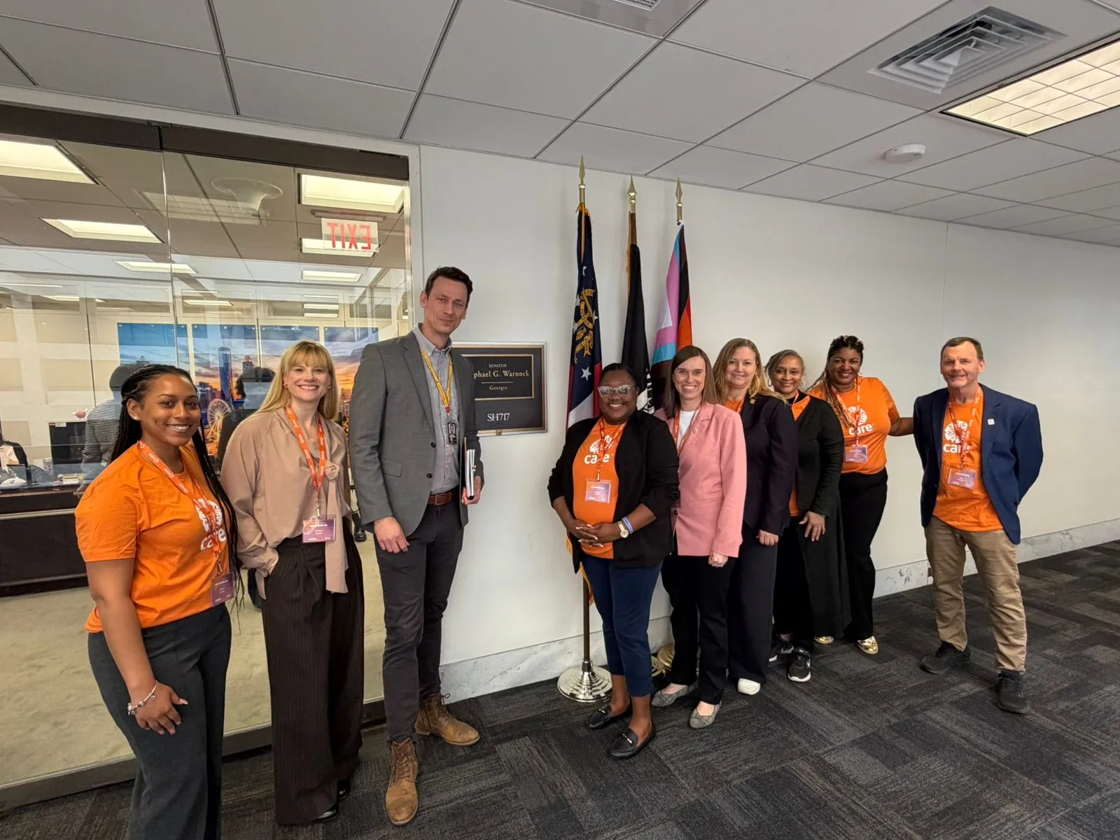 CARE advocates stand with staffers from Senator Raphael Warnock’s office in Atlanta during CARE on Capitol Hill.