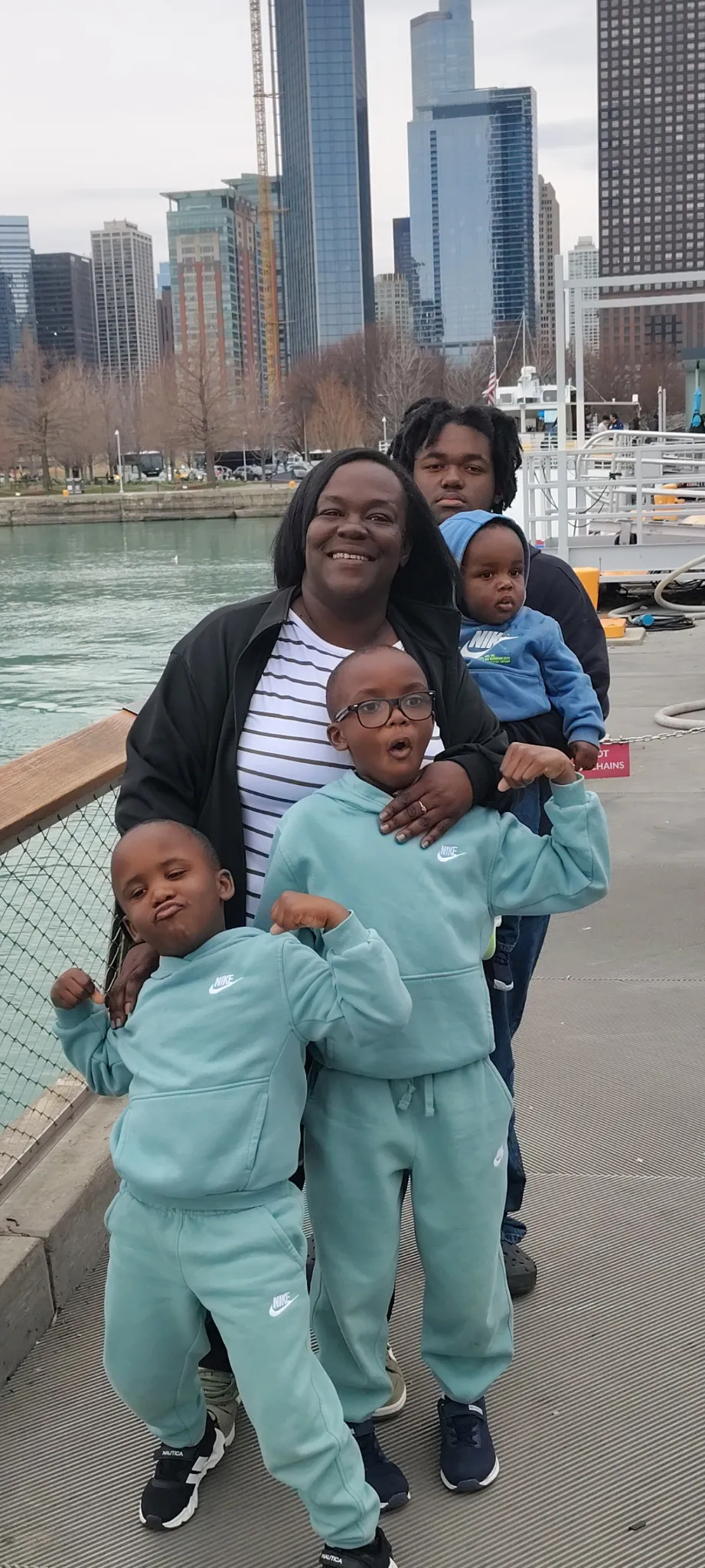 A mom and her four sons pose for a picture.