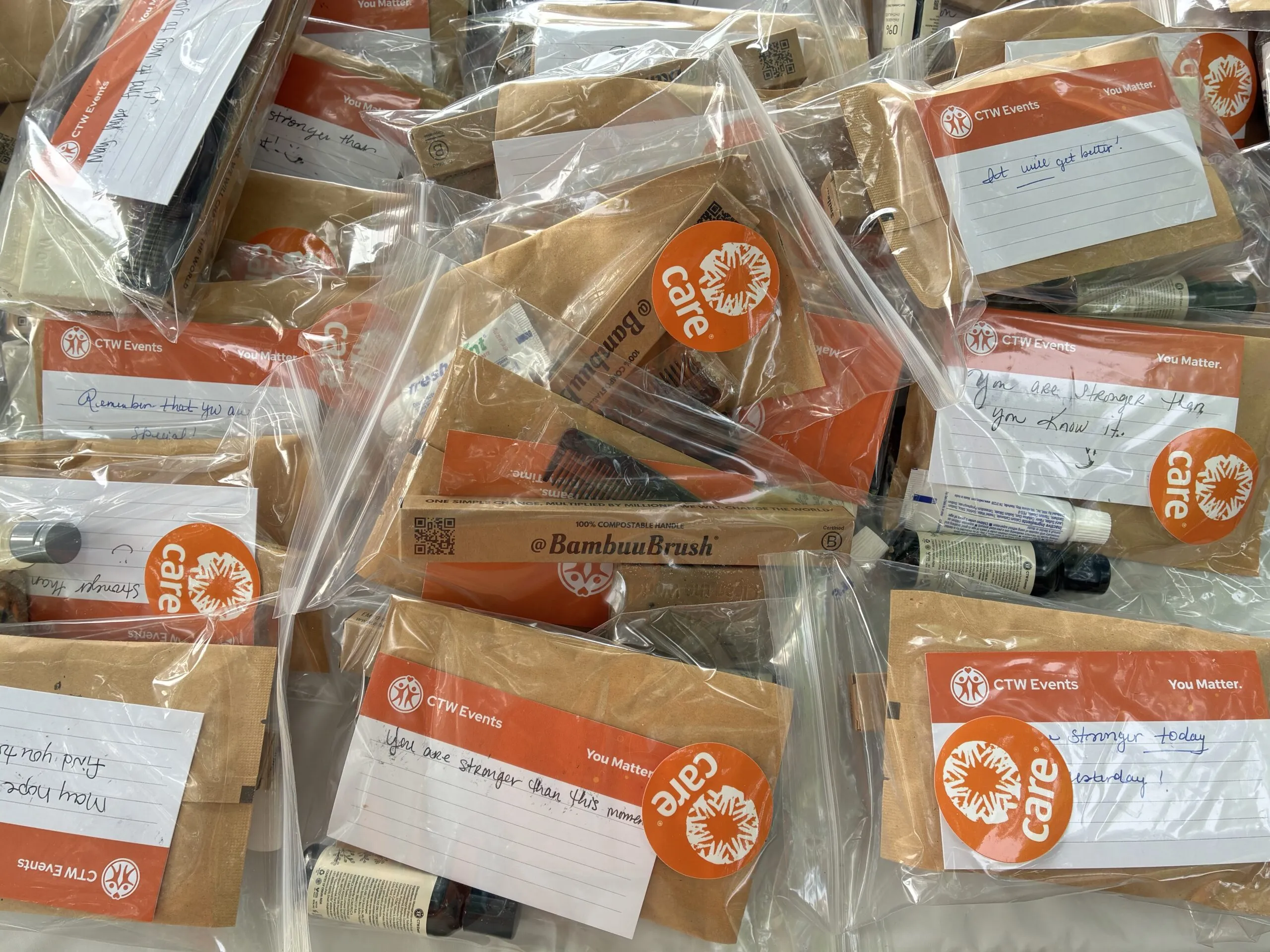 A collection of CARE PACKAGE hygiene kits