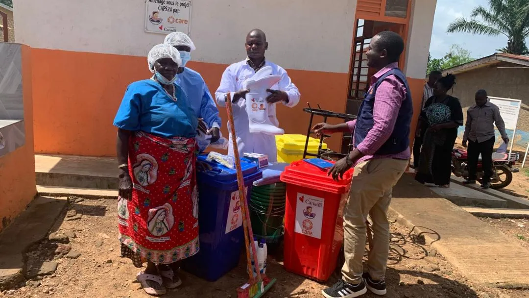 CARE staff dons and distributes Personal Protective Equipment (PPE) in Goma.