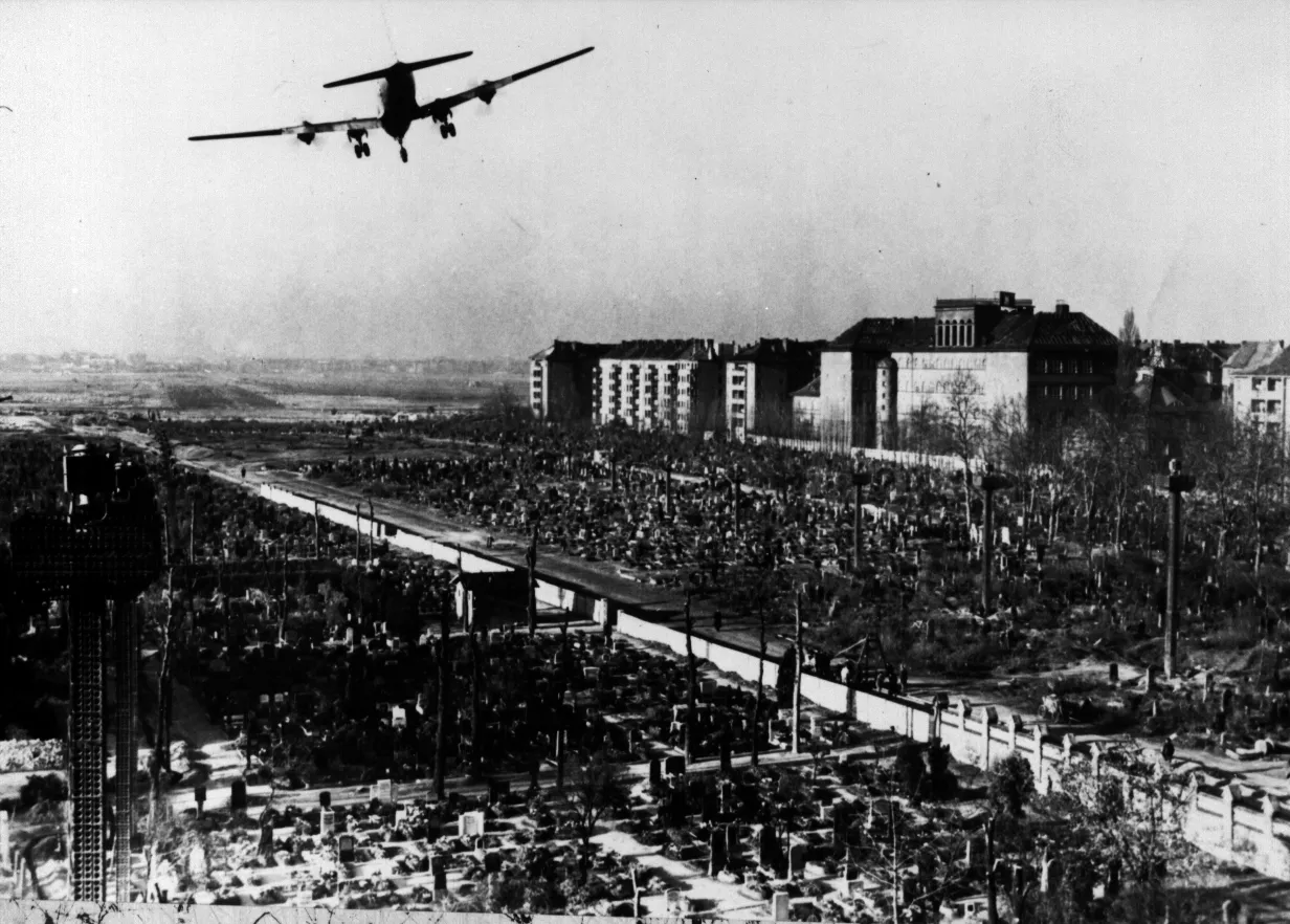 A U.S. cargo plane flying over the city of Berlin.