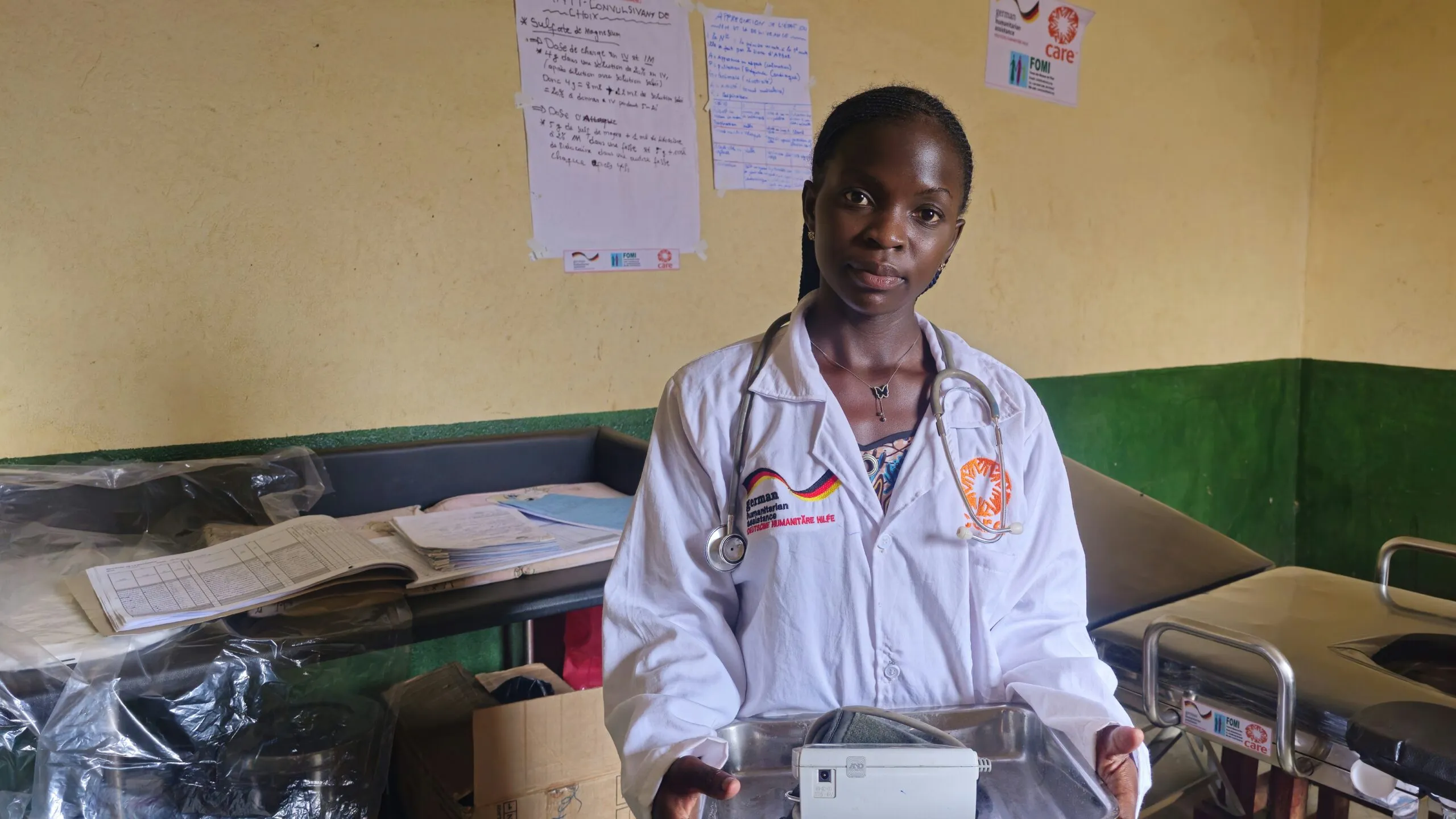 A healthcare professional holds a tray of tools at a clinic in the DRC.