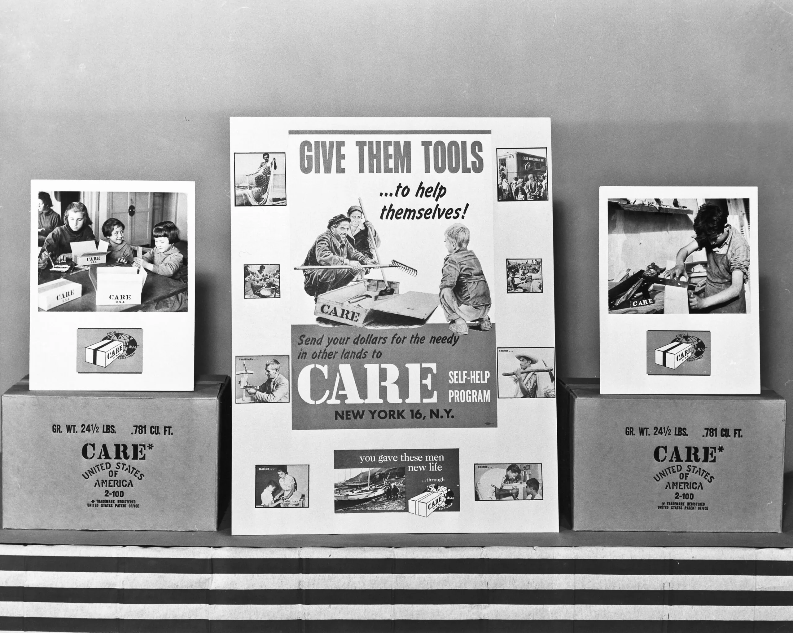 A historical image of a CARE ad display for self-help programs and CARE PACKAGE boxes.