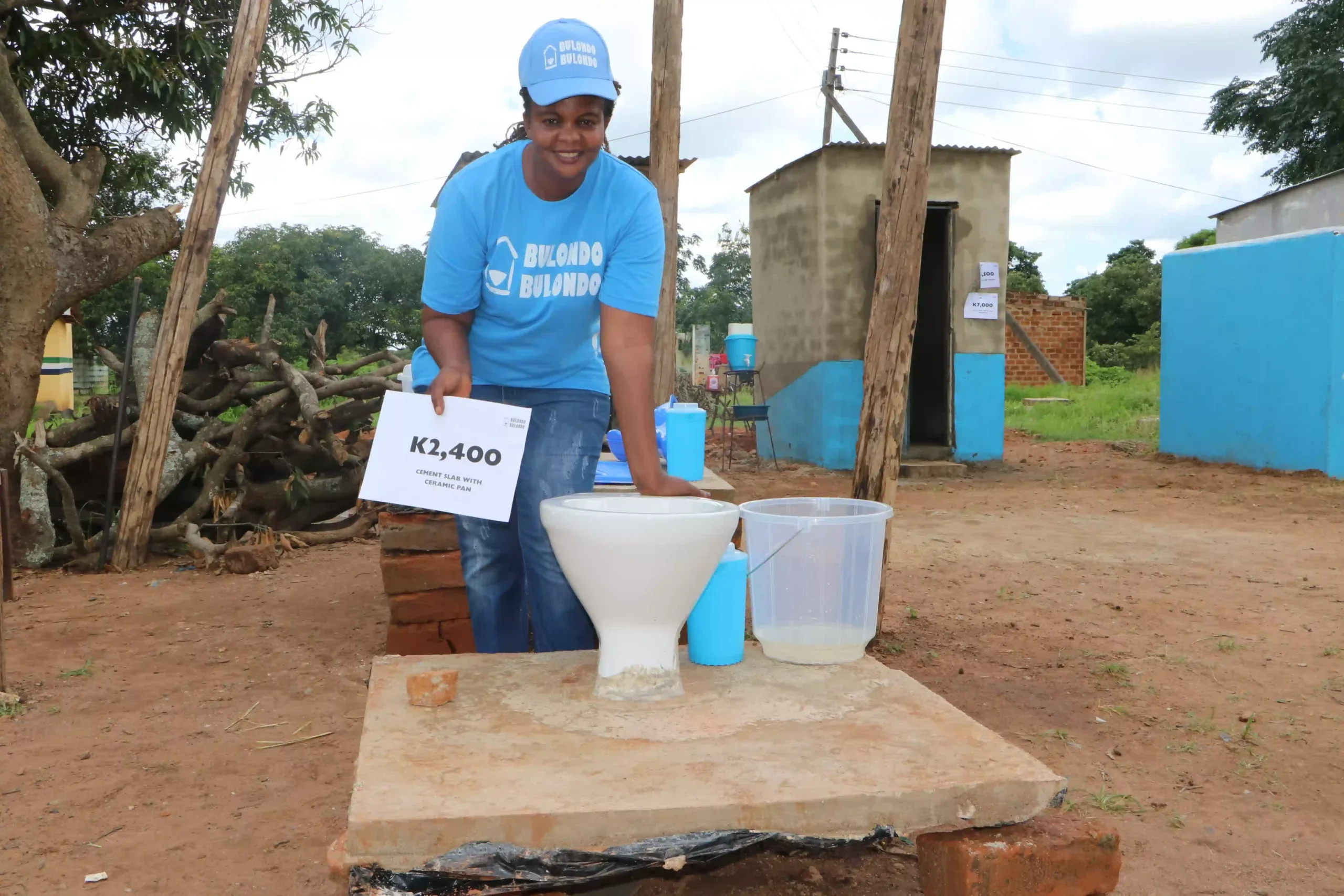 A smiling woman wearing a blue 