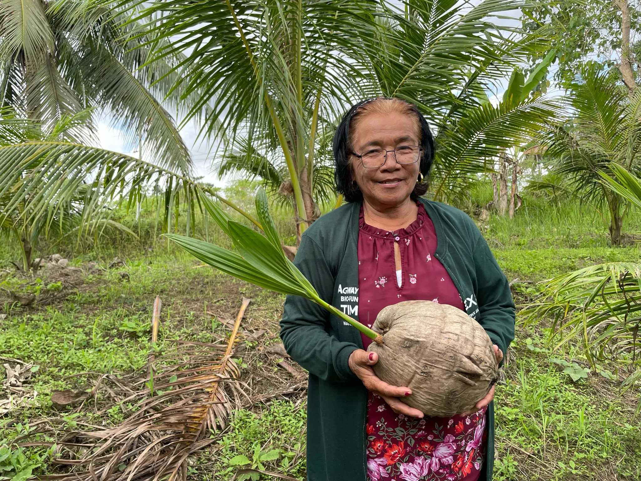 Woman holding a coconut