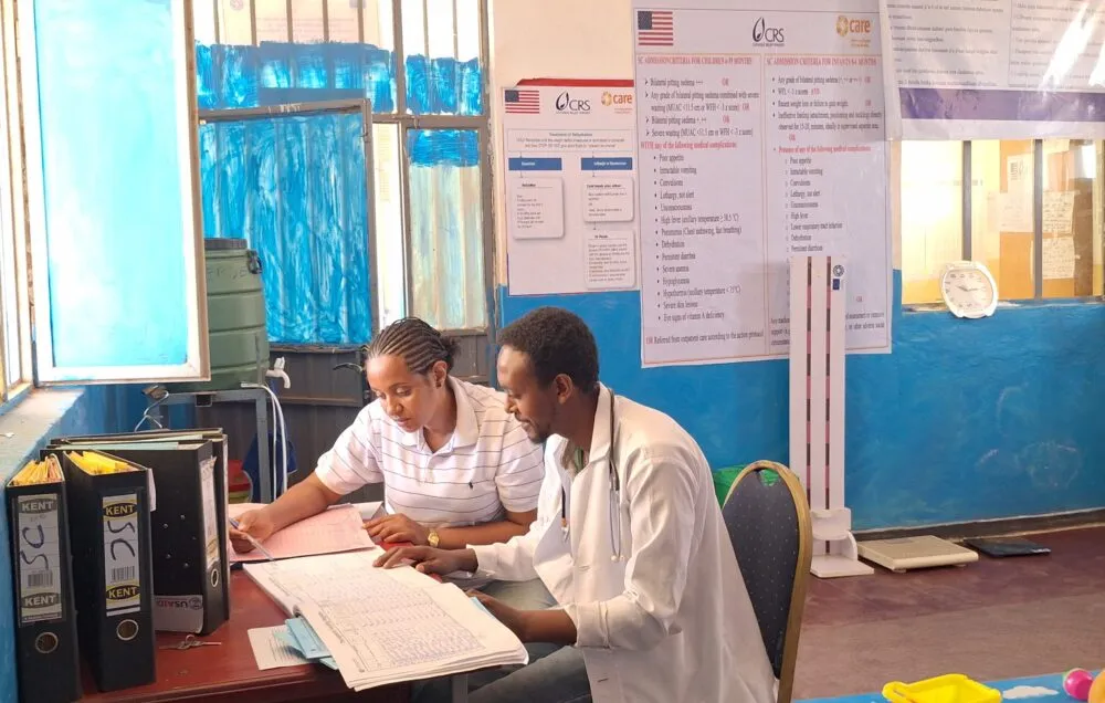 CARE nurse Meskrem Debru and health officer Zekarias Getachew monitor children receiving nutrition treatment.